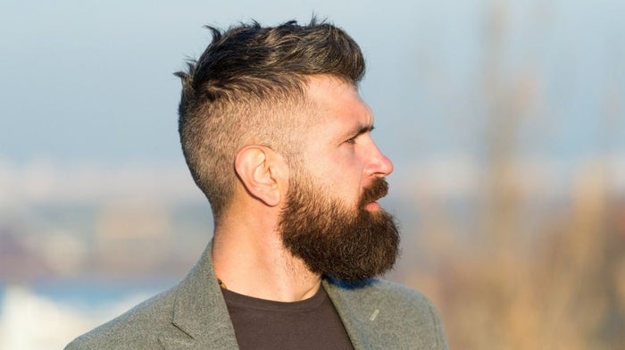 side profile of a man with a well-groomed beard