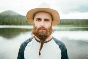 A man wearing a hat sporting a braided Viking beard | Gillette UK