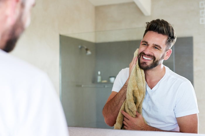 man towelling off post-shave