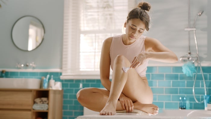 Women shaving with slow steady strokes