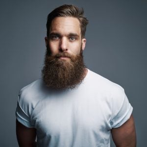 A man in a white T-shirt sporting a long, full Viking beard | Gillette UK