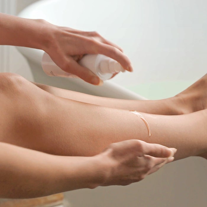 massaging oil into legs