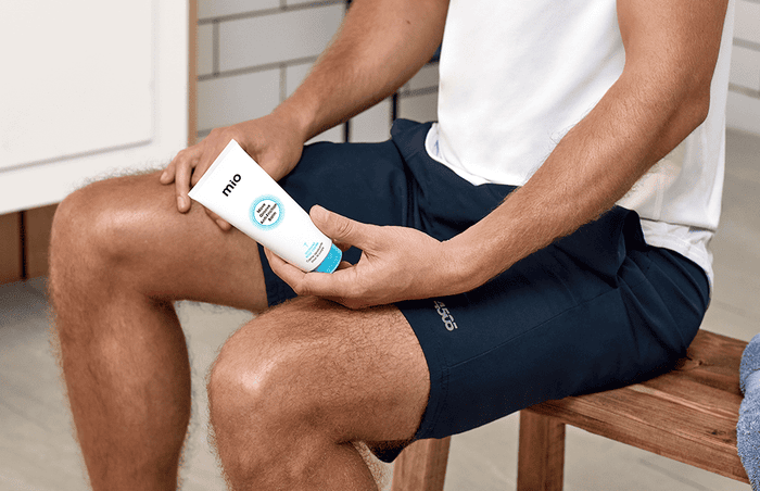 man applying chafing cream before exercise