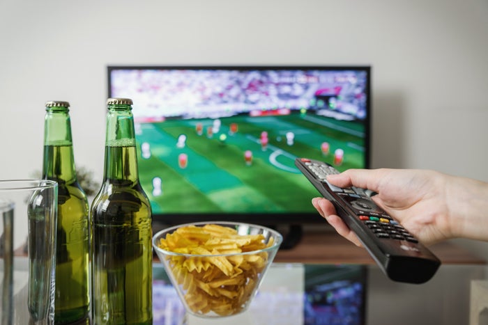 beer and snacks in front of football