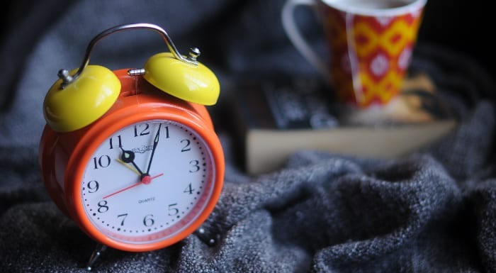 orange and yellow alarm clock