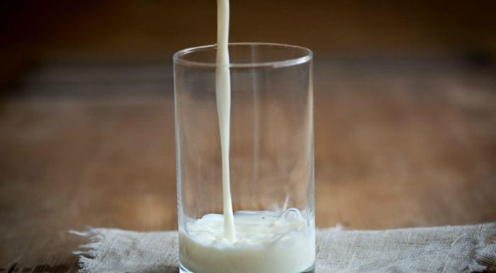 milk being poured into a glass