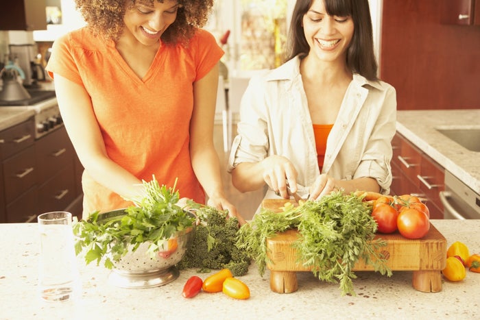 friends chopping vegetables