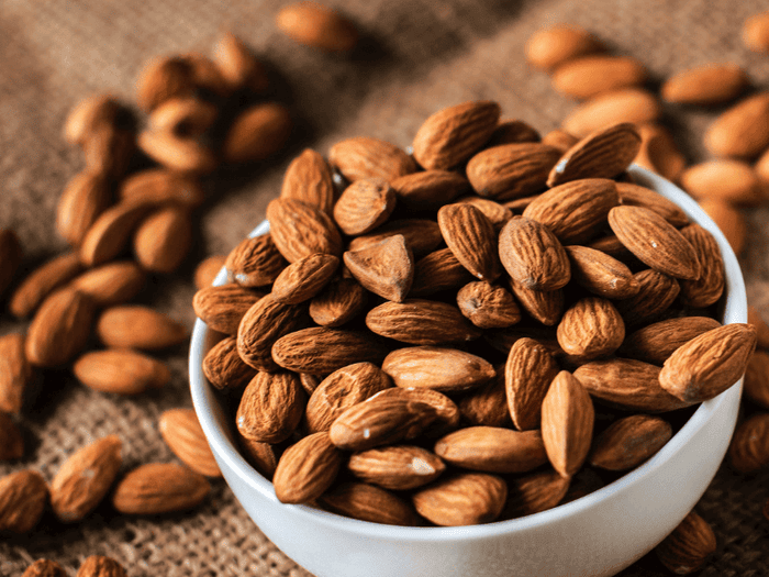 A bowl of almonds, which contain magnesium