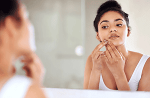 Breaking Out: The Very Real Social & Psychological Effects of Acne
