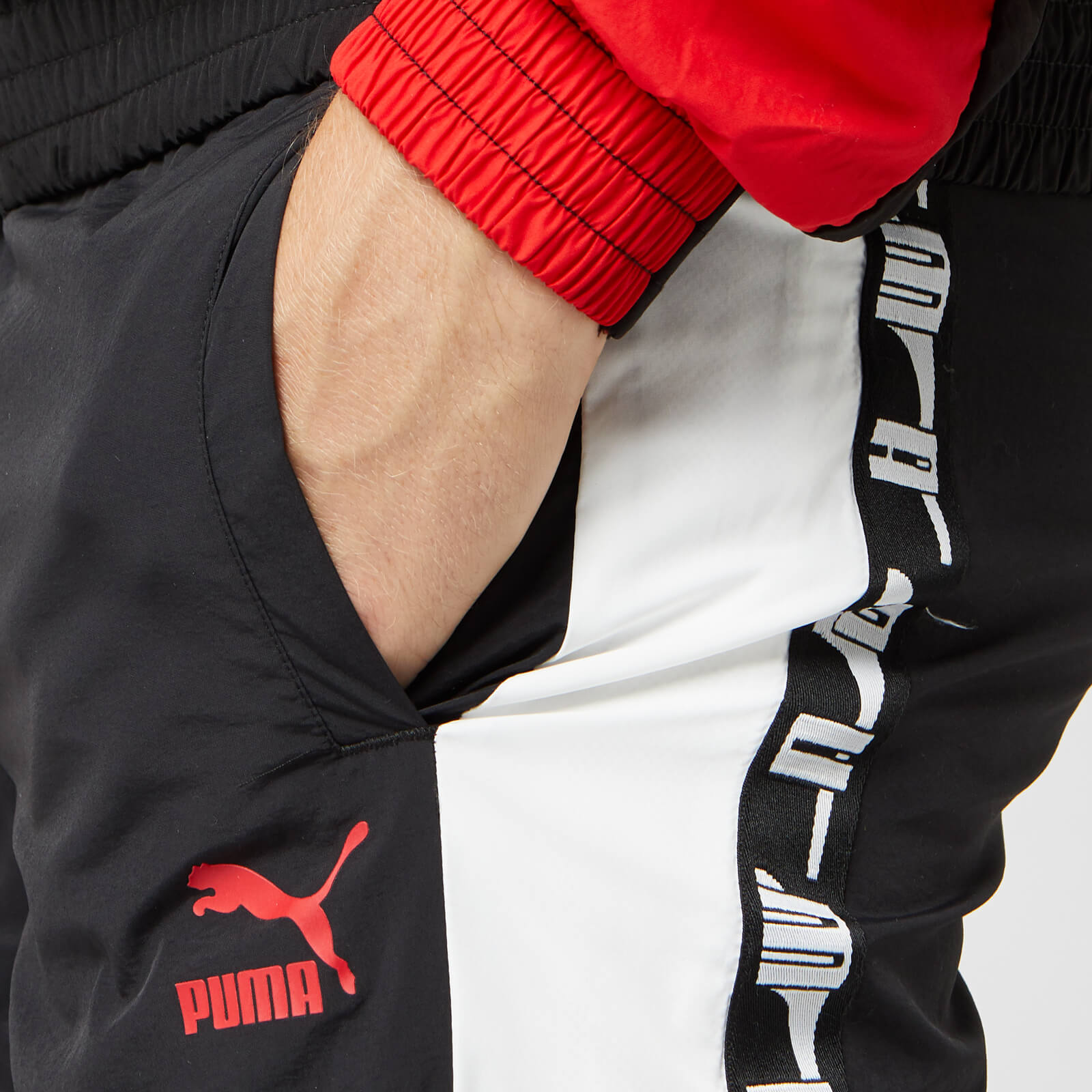 Puma Men s XTG Woven Pants Puma Black Red Combo Allsole