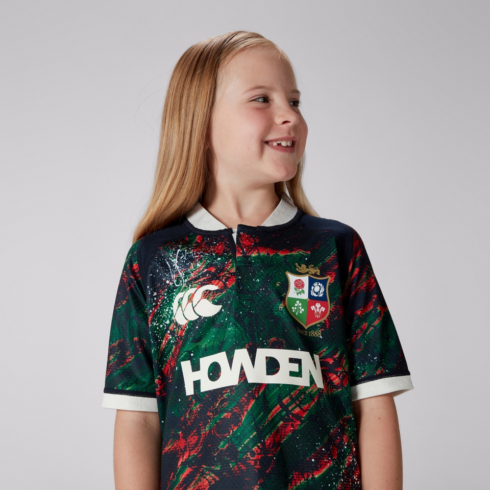JUNIOR UNISEX BRITISH & IRISH LIONS WARM UP JERSEY NAVY/GEEN/RED