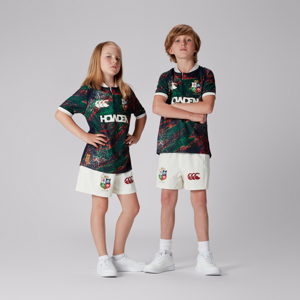JUNIOR UNISEX BRITISH & IRISH LIONS WARM UP JERSEY NAVY/GEEN/RED