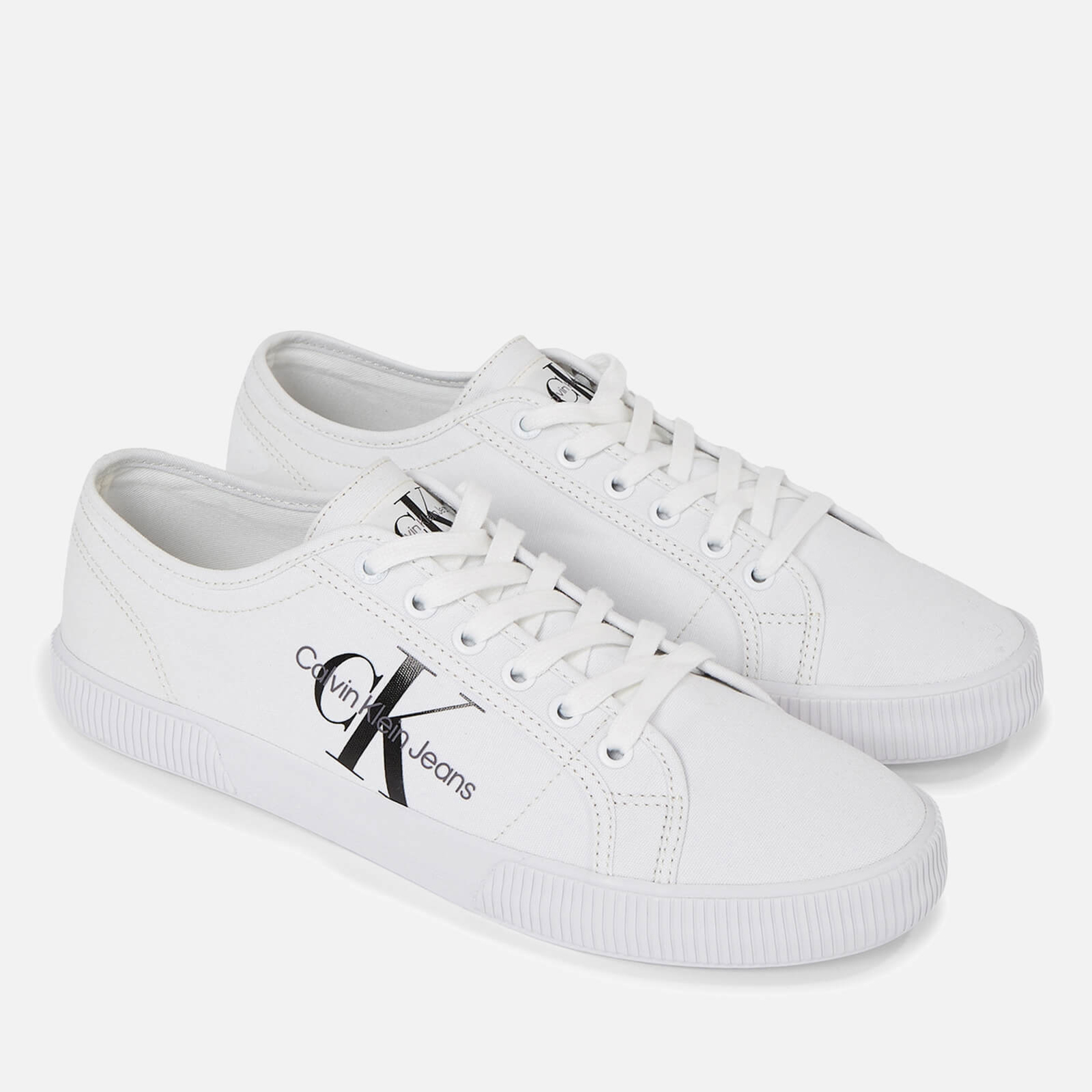 Calvin klein ireland hotsell canvas white plimsoll trainers