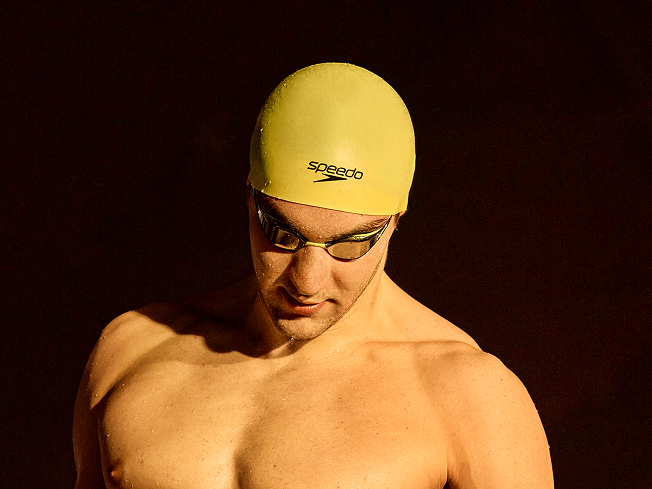 Shop Fastskin caps – man wearing yellow Fastskin cap and yellow Fastskin goggles.