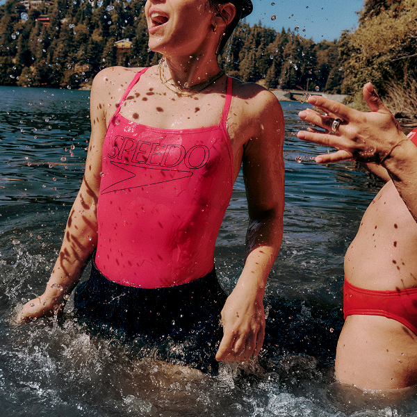 women splashing in water
