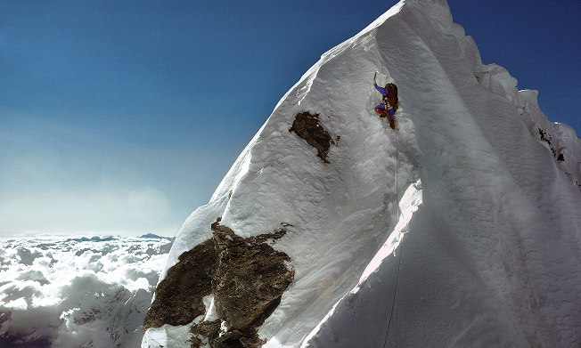 The peak of a snowy mountain