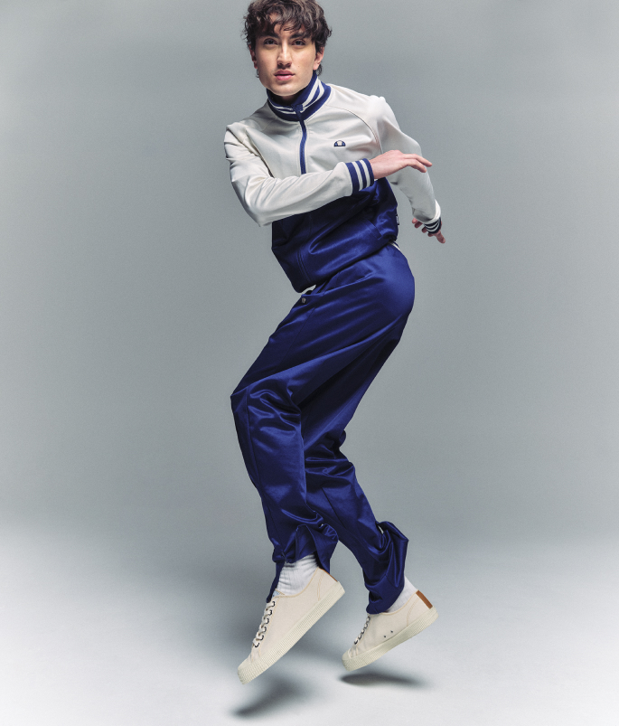 Man modelling a blue ellesse Tracksuit