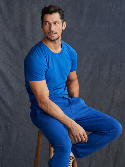 David Gandy sat wearing a blue sweat set