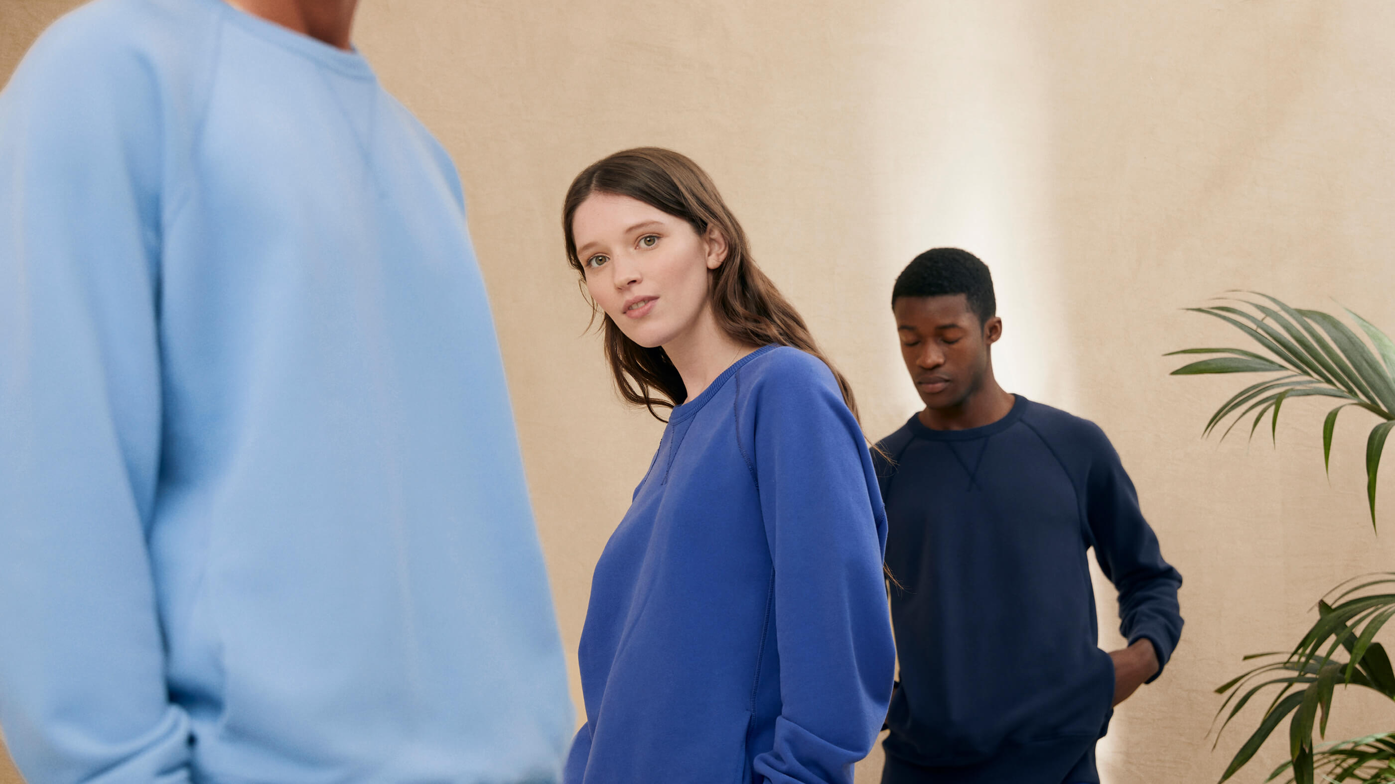 models wearing light blue, workwear blue and navy long sleeve sweatshirts