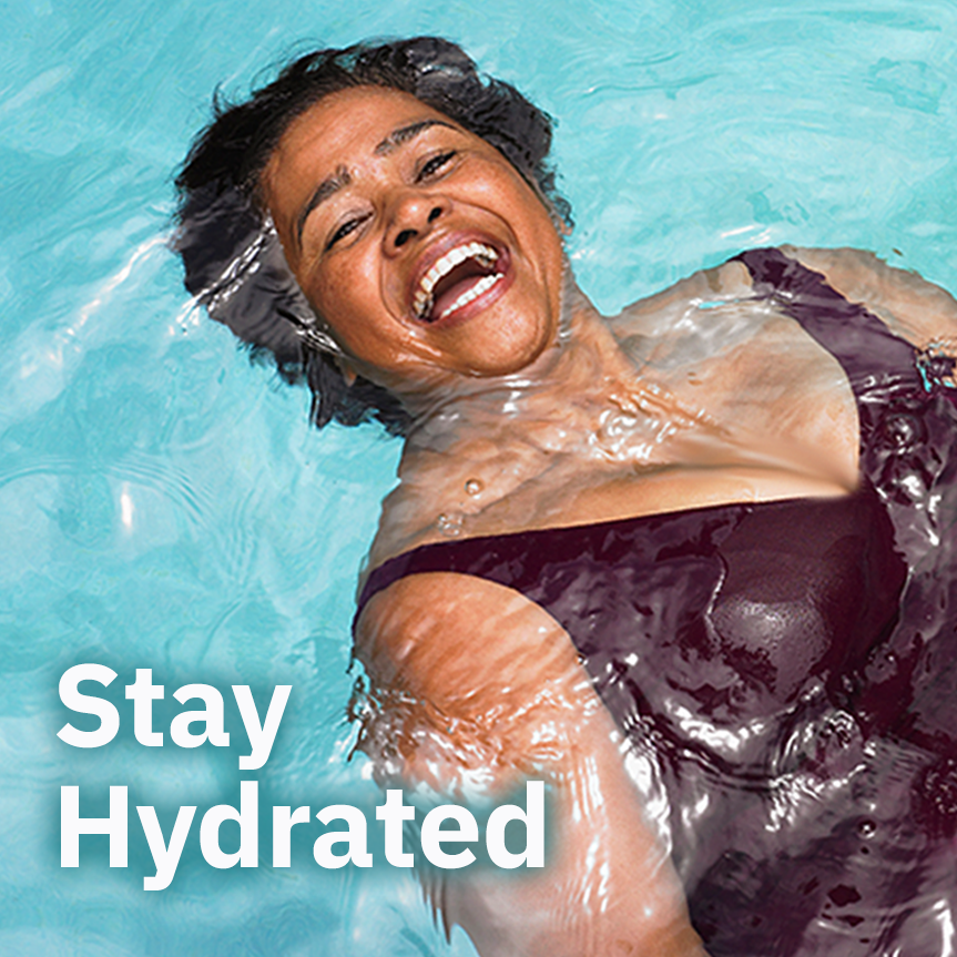 A woman smiling while swimming with text overlay "Stay Hydrated"