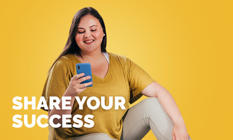 A women sitting with her phone with text overlay "share your success"