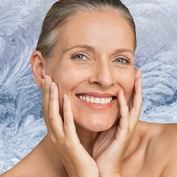 Womeh with her hand out and Product spotted on her face to show Pevonia Skin Care Products and promote the Refer a Friend Scheme