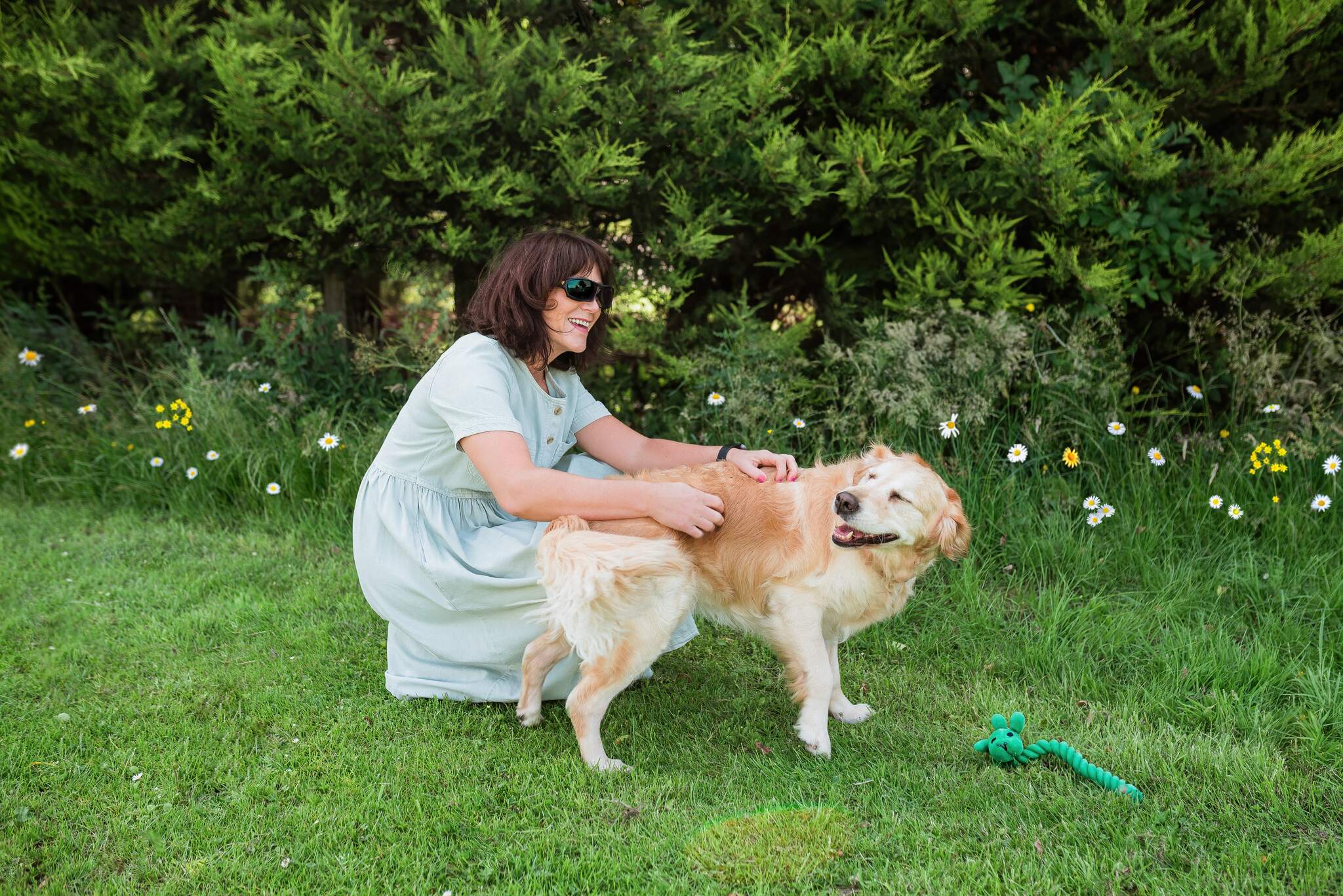 a dog playing with a women