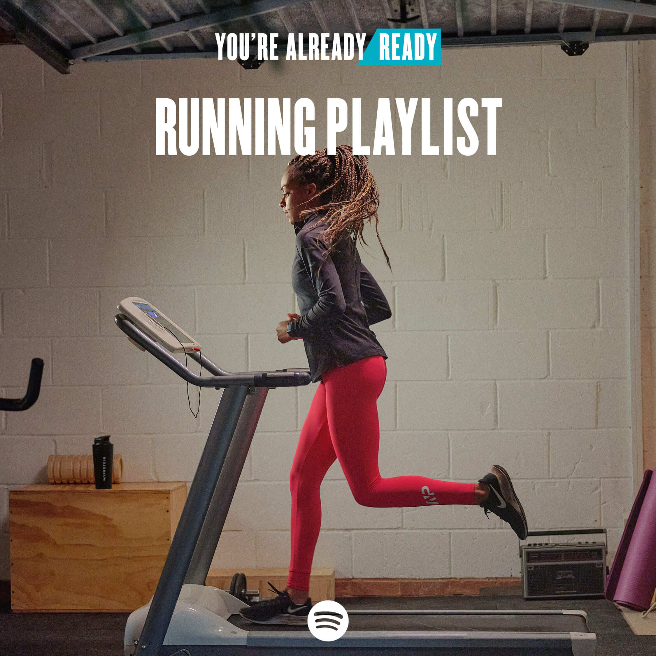 A woman running on a treadmill wearing MP workout clothes with the words 'You're Already Ready - Running Playlist' overlaying.