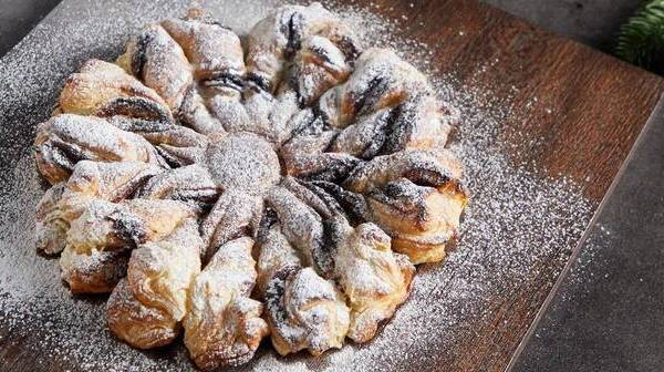 A chocolate spread puff pastry star, dusted with icing sugar - ideal for sharing.