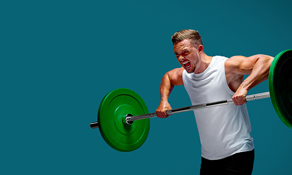 .A 40kg barbell being lifted by a man in a white tank top and wearing black shorts.