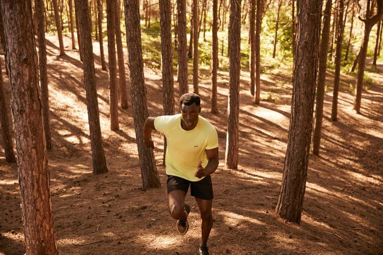 man running in forest