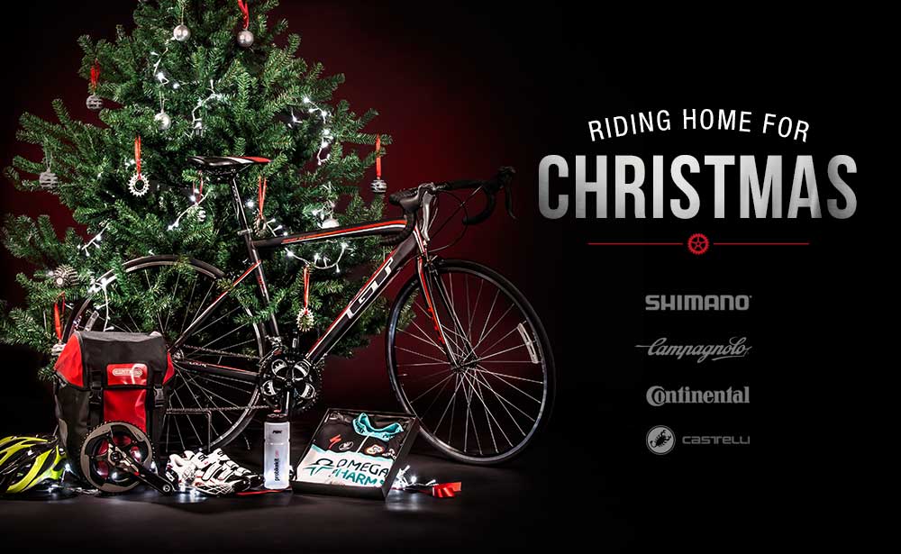 a road bike propped up against a christmas tree